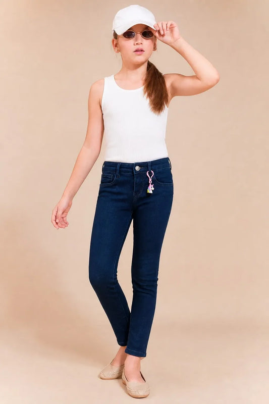 Girl in denim blue charm-detail ankle skinny jeans with a white tee, Gilly Billy