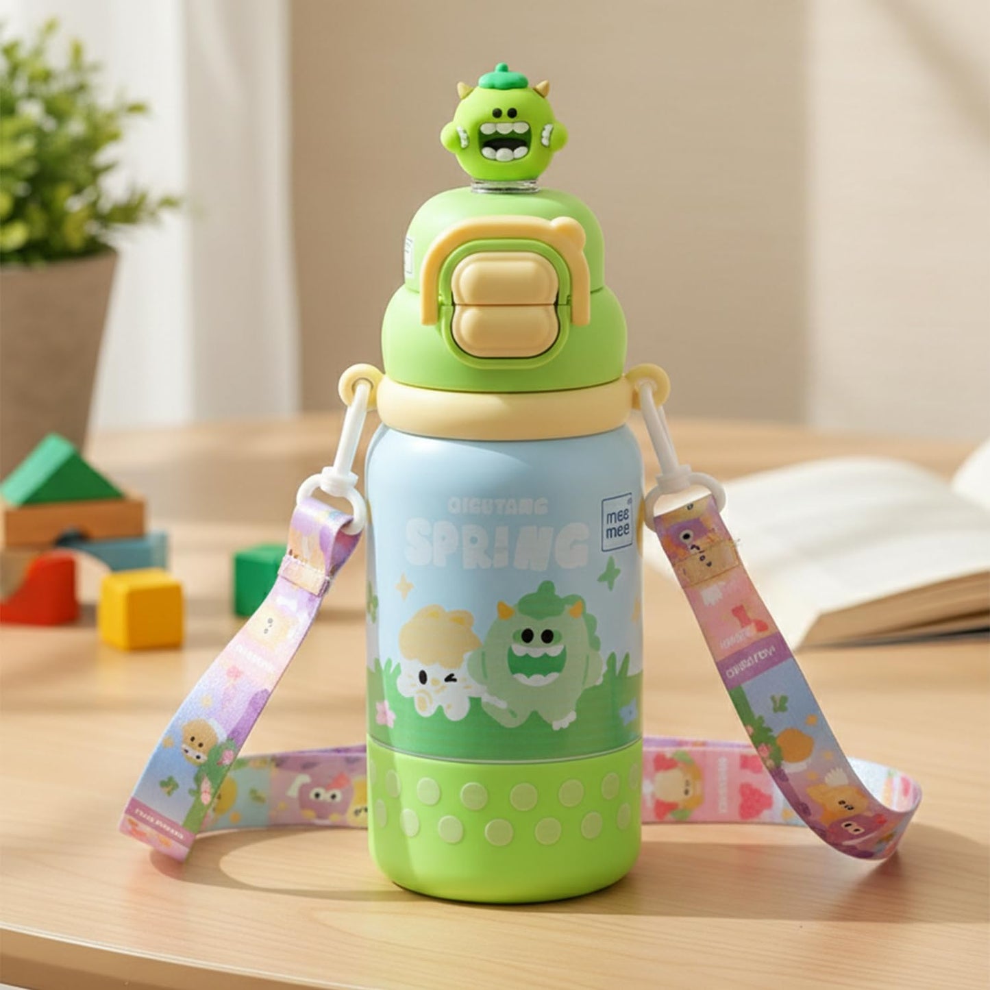 Green Mee Mee Oasis insulated toddler sipper cup with shoulder strap