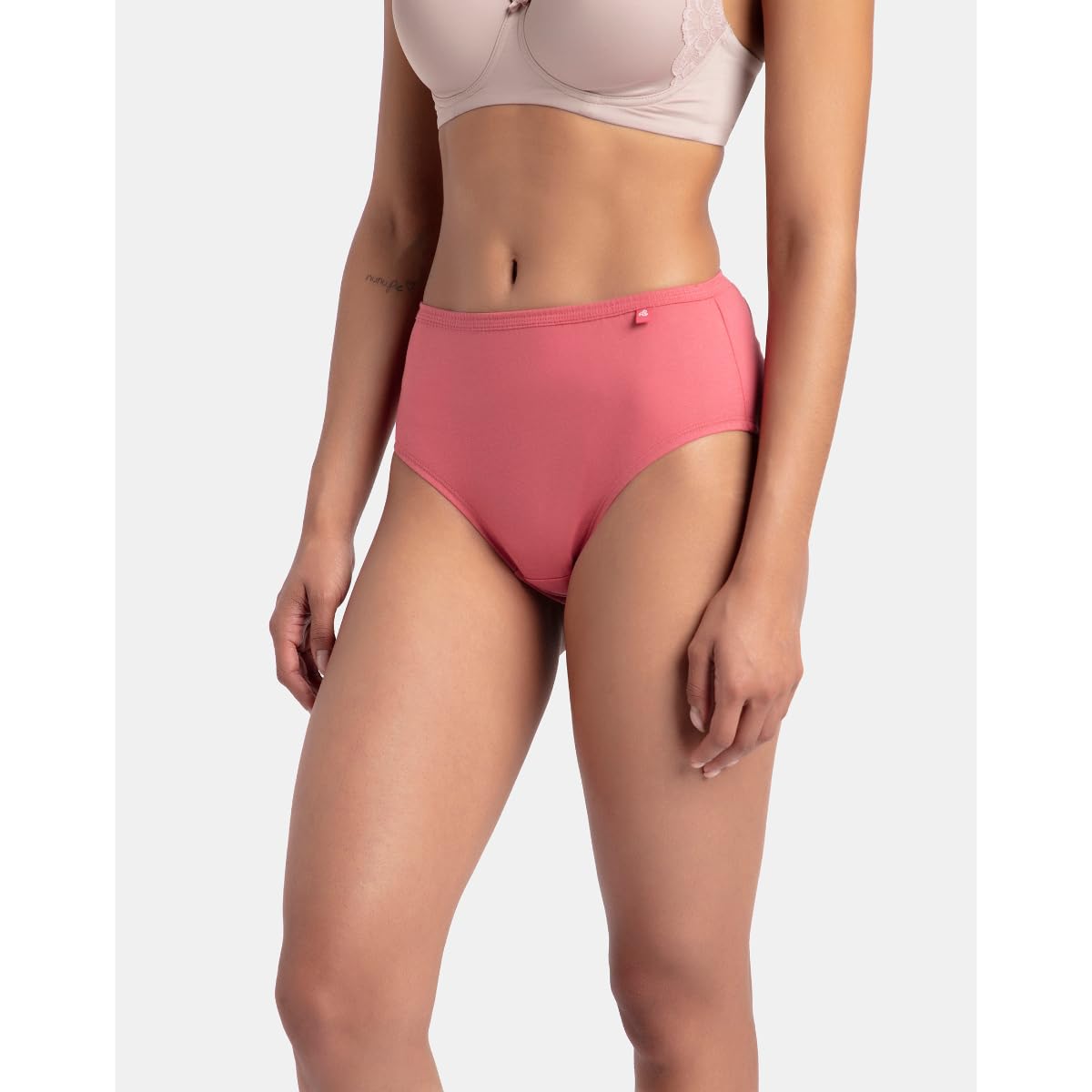 Side view of a Jockey coral pink cotton hipster panty showing the low-rise fit