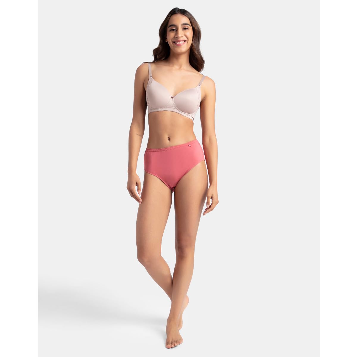 Full-length shot of a model wearing a Jockey coral pink cotton hipster panty