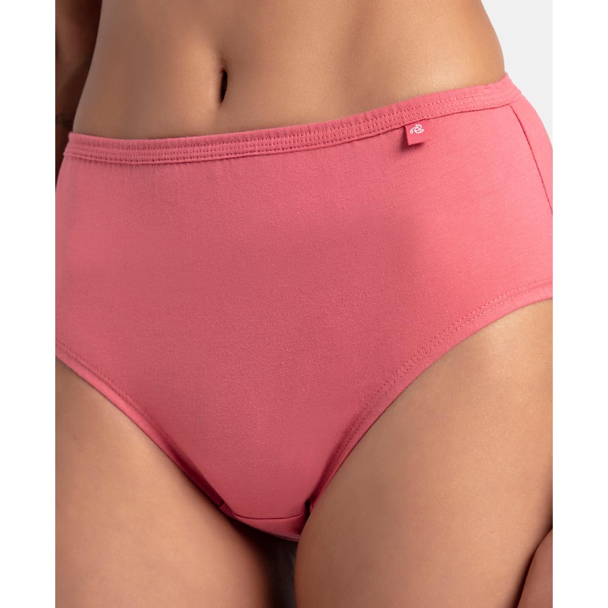 Close-up of the soft covered waistband on a Jockey coral pink cotton hipster panty