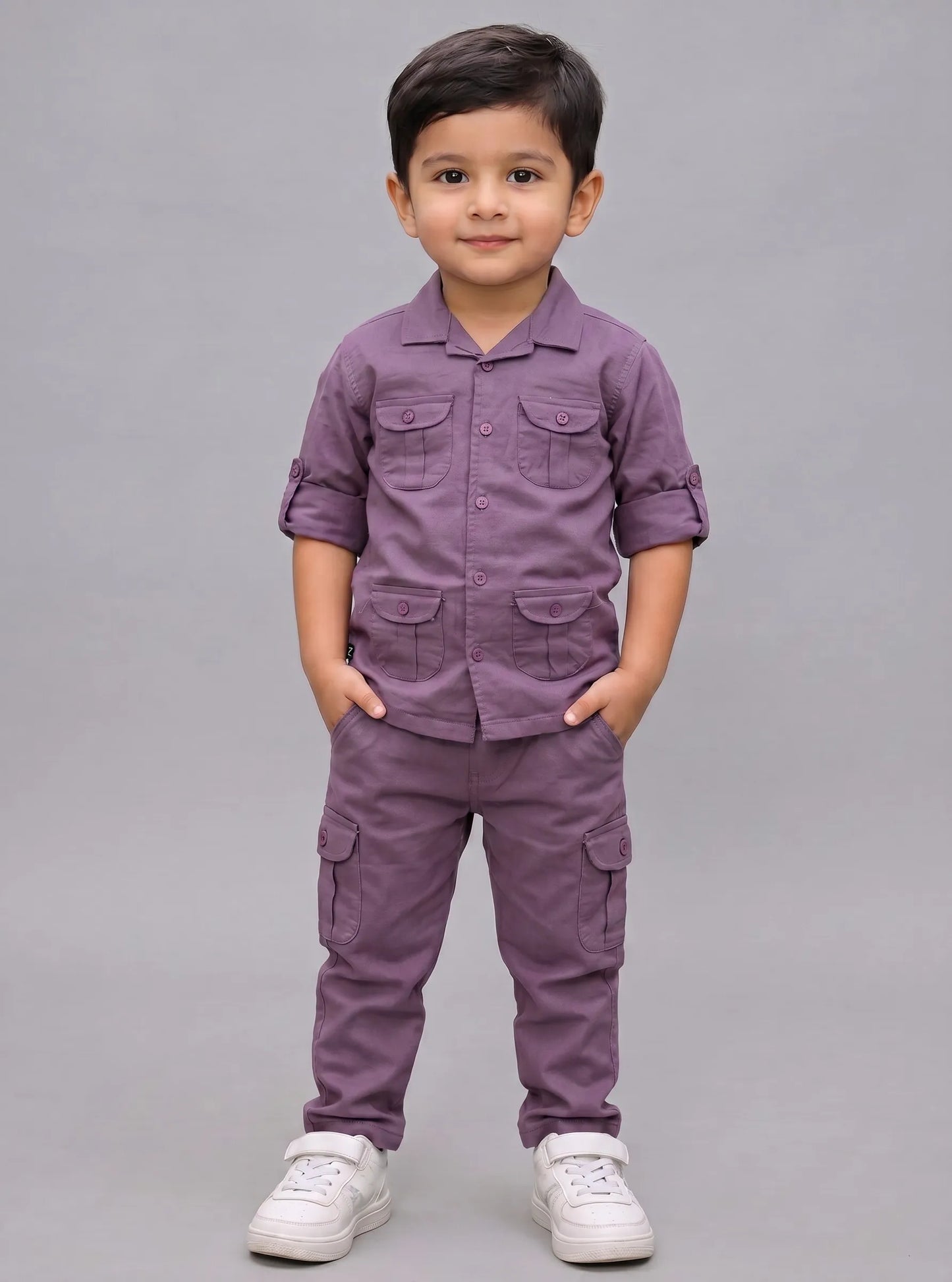 Boy in a purple co-ord shirt and matching pant set by Boyz Fun