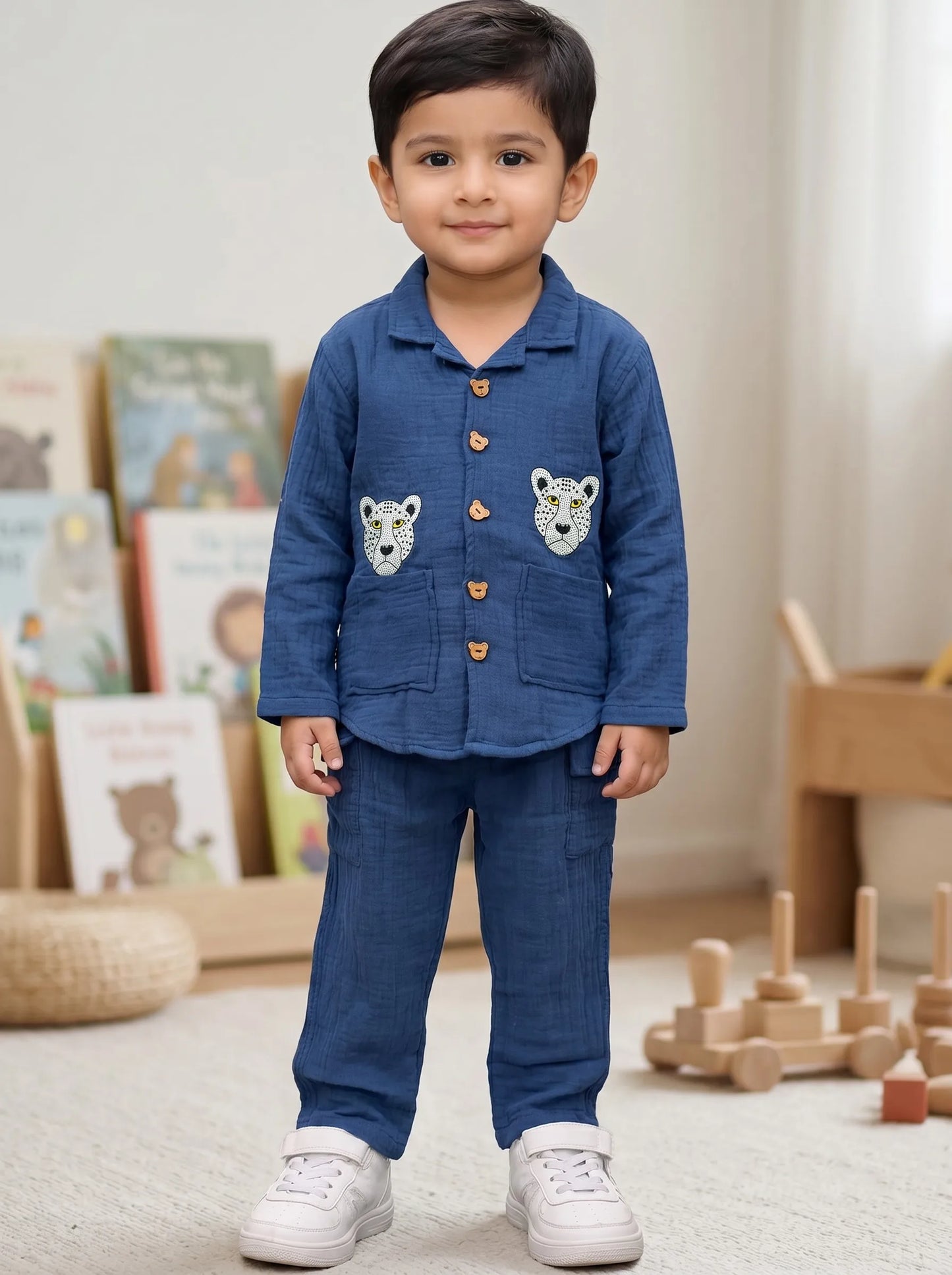 Boy in a blue leopard print muslin shirt and trouser co-ord set by Boyz Fun