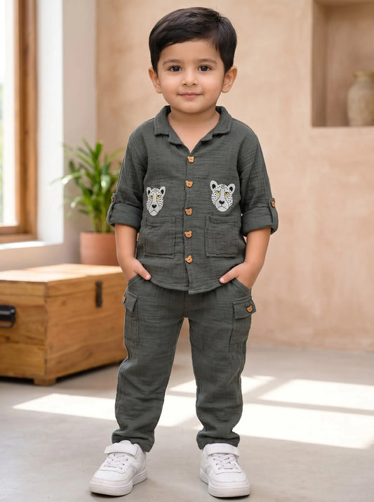 Boy in a green leopard print muslin shirt and trouser co-ord set by Boyz Fun