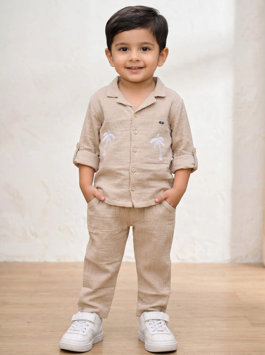 Boy in a biscuit palm tree print muslin co-ord set by Boyz Fun