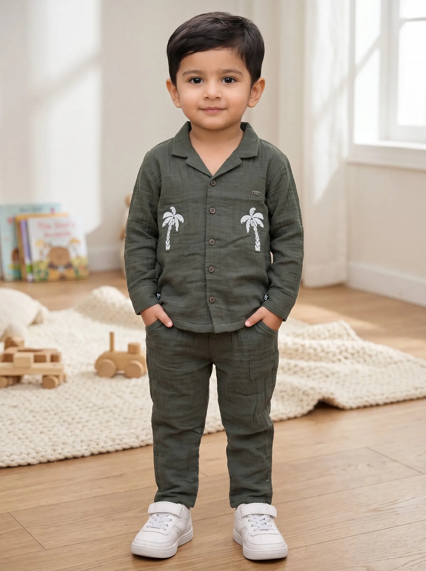 Boy in a green palm tree print muslin co-ord set by Boyz Fun