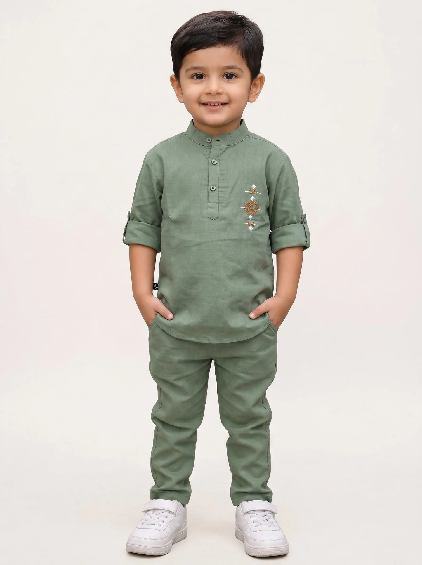 Boy in a green embroidered kurta and matching pant set by Boyz Fun