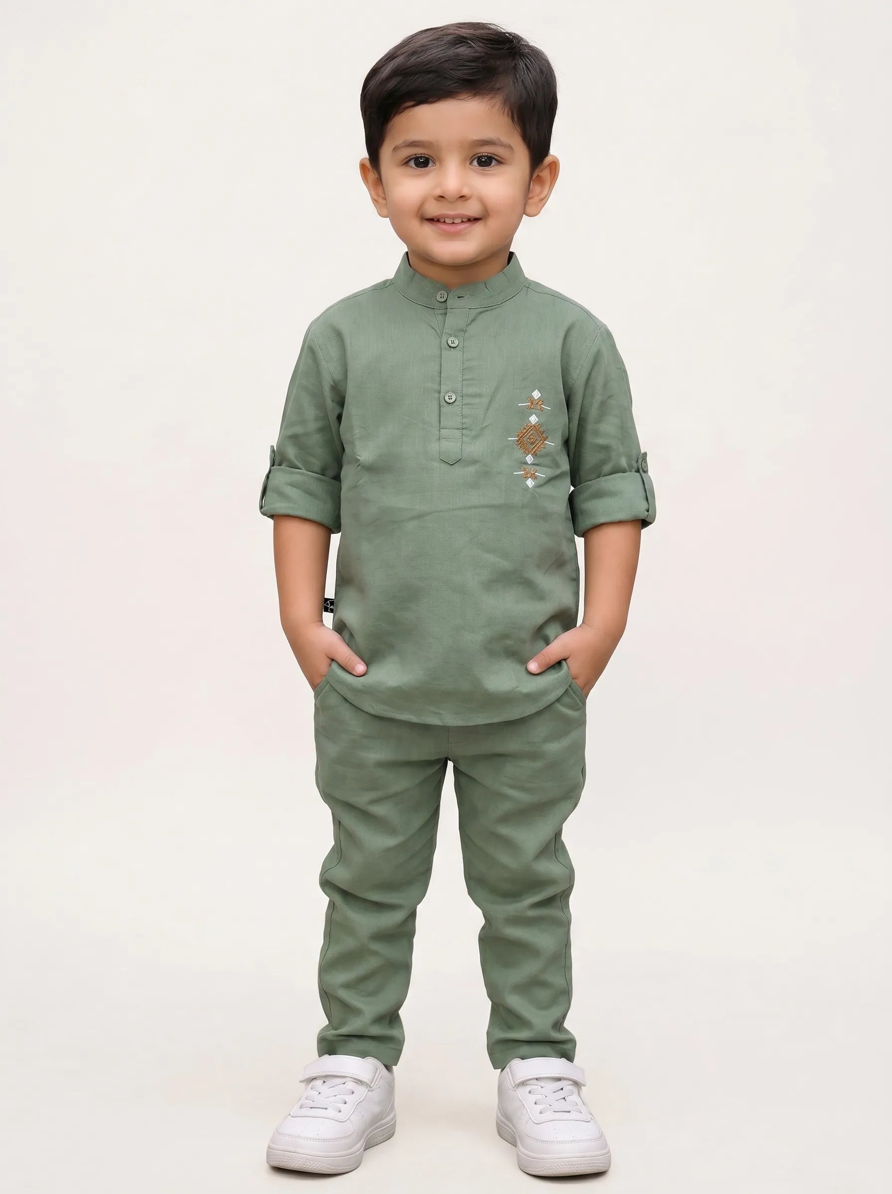 Boy in a green embroidered kurta and matching pant set by Boyz Fun