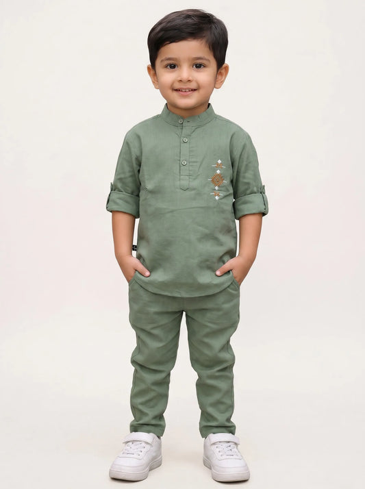 Boy in a green embroidered kurta and matching pant set by Boyz Fun