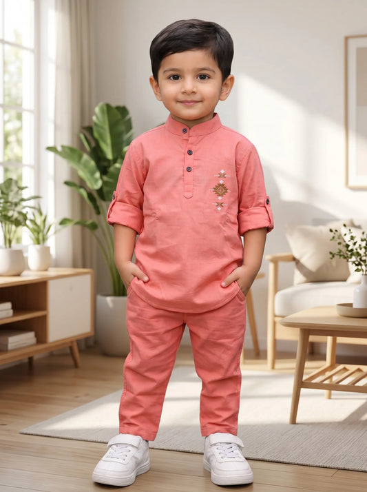 Boy in an orange embroidered kurta and matching pant set by Boyz Fun