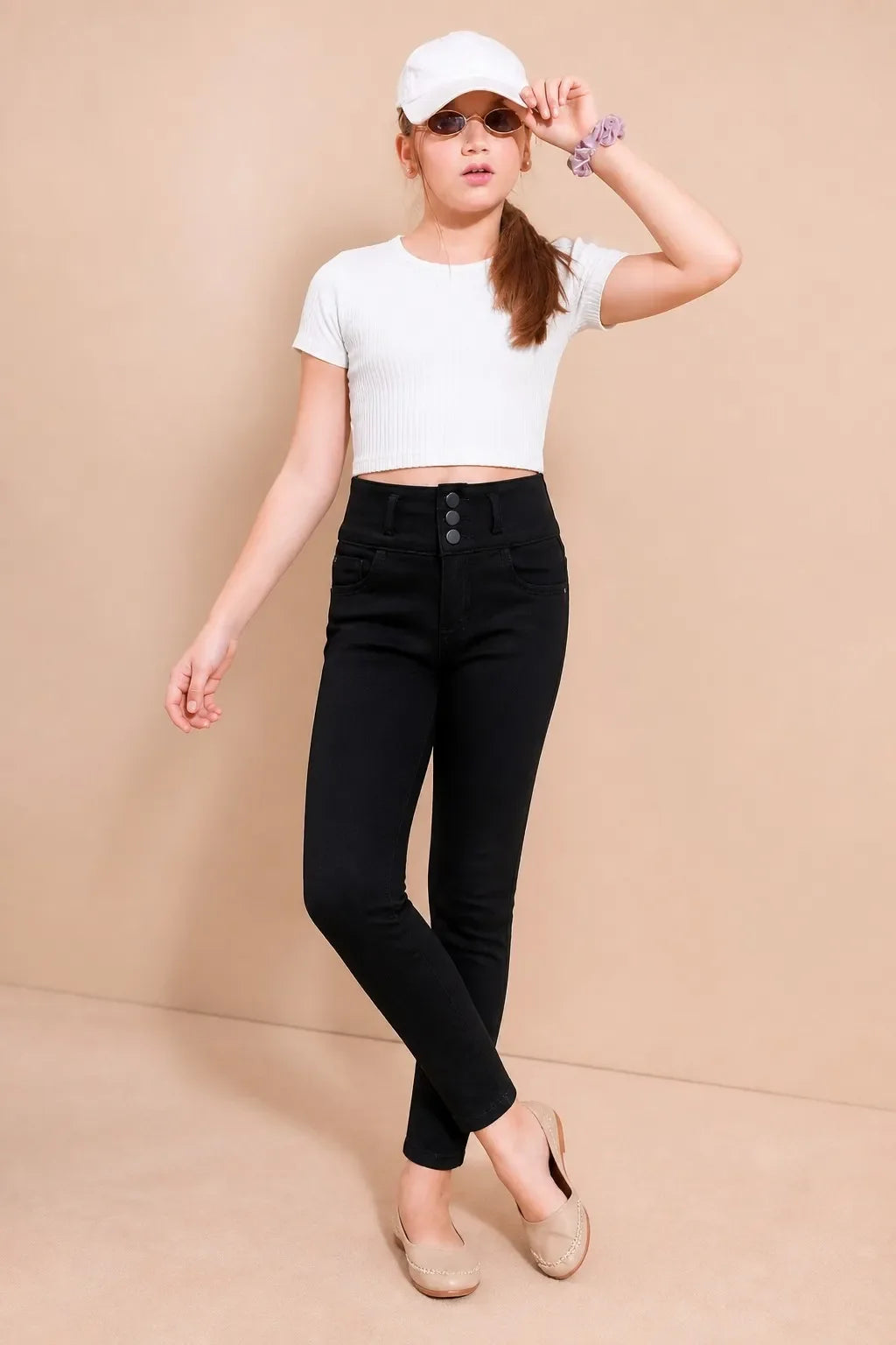 Girl in black triple-button ankle skinny jeans with a white tee, Gilly Billy