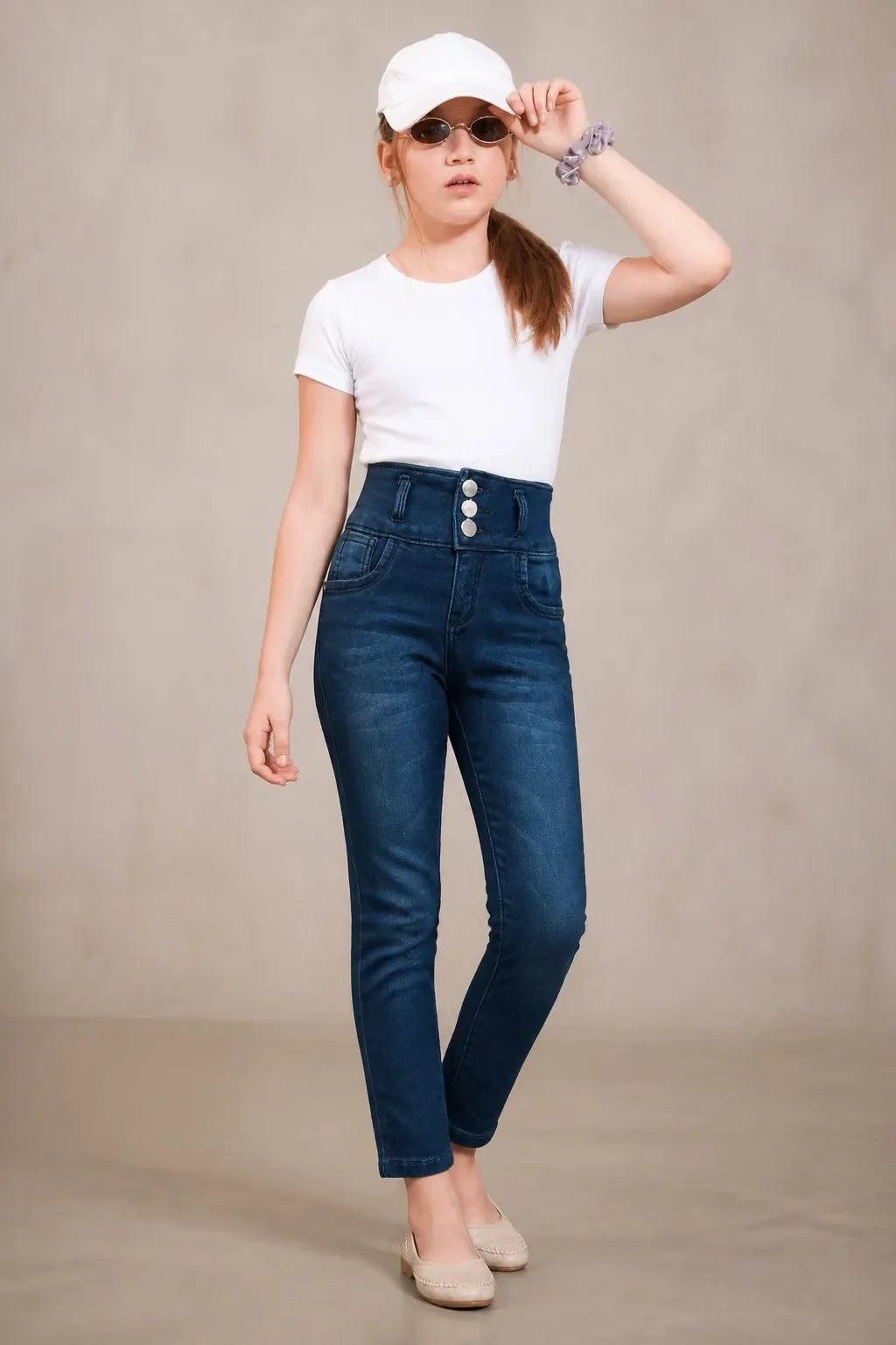 Girl in denim blue triple-button ankle skinny jeans with a white tee, Gilly Billy