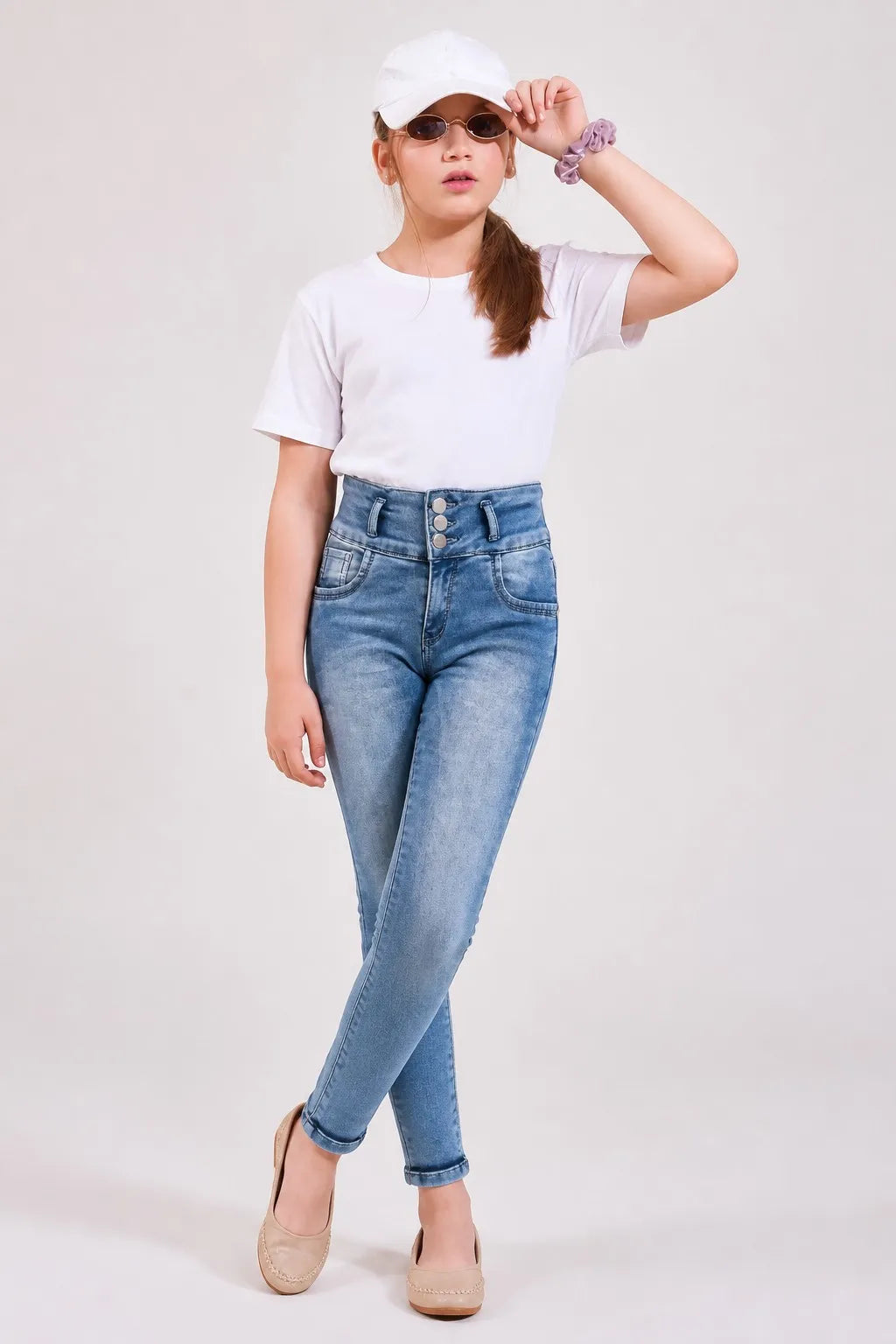Girl in stone blue triple-button ankle skinny jeans with a white tee, Gilly Billy