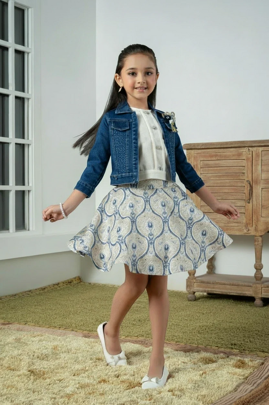 Girl in a cream denim jacket with printed skirt set by Mini Angel