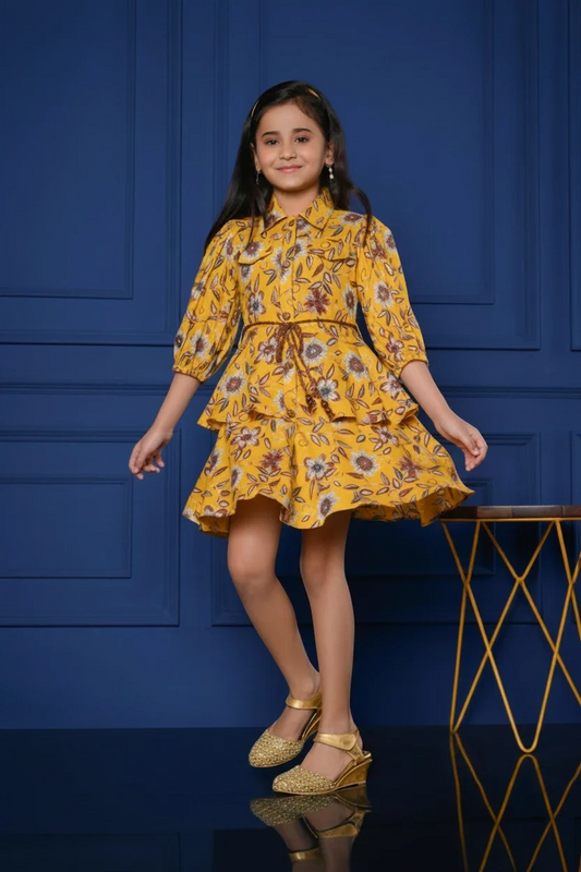 Girl in a mustard floral frock set by Mini Angel