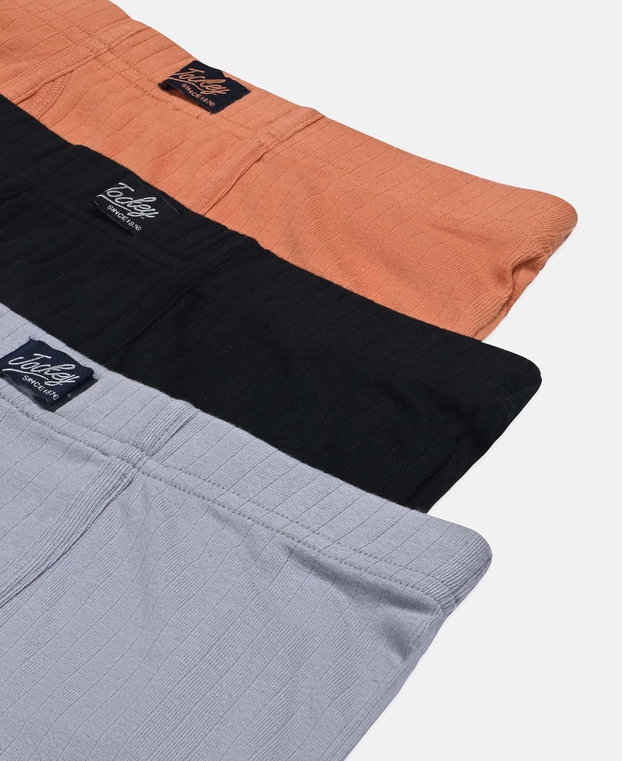 Jockey boys cotton rib trunks in orange, black and grey, stacked