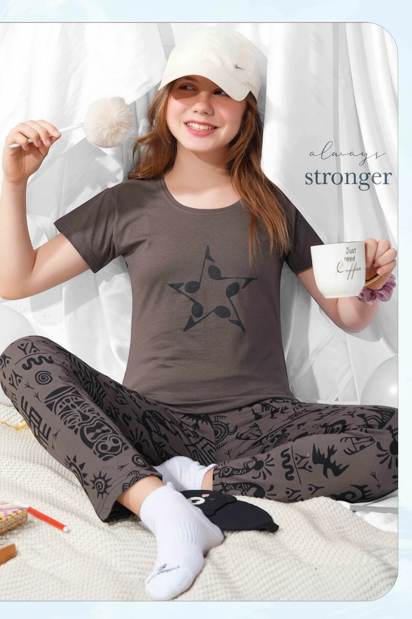 Girl in a brown musical star print tee and matching printed pyjama by In Touche