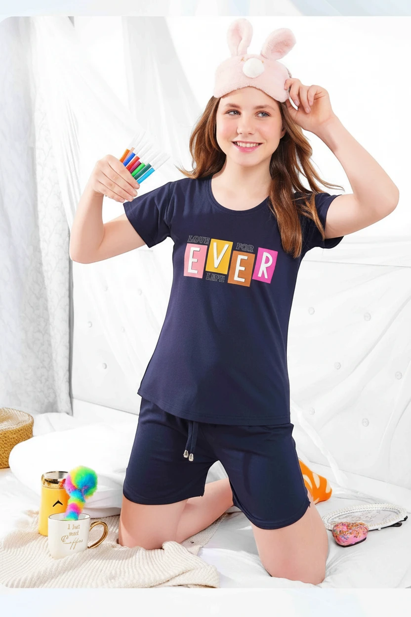 Girl in a blue Love Life tee and navy shorts, In Touche kids shorts set