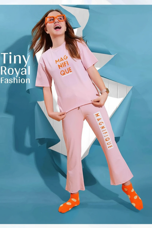 Girl in a pink Magnifique print top and flared trousers, In Touche co-ord set