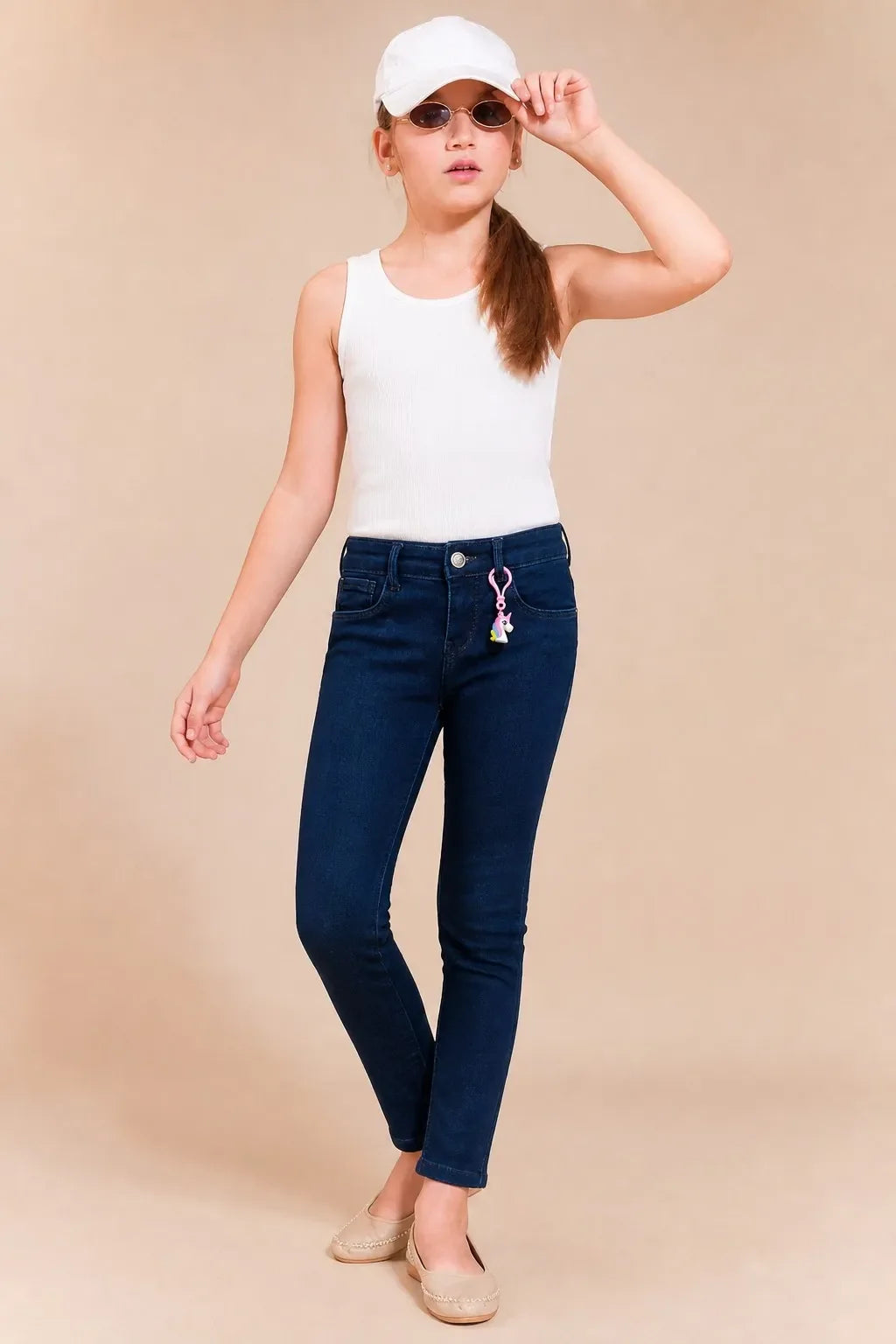 Girl in denim blue charm-detail ankle skinny jeans with a white tee, Gilly Billy