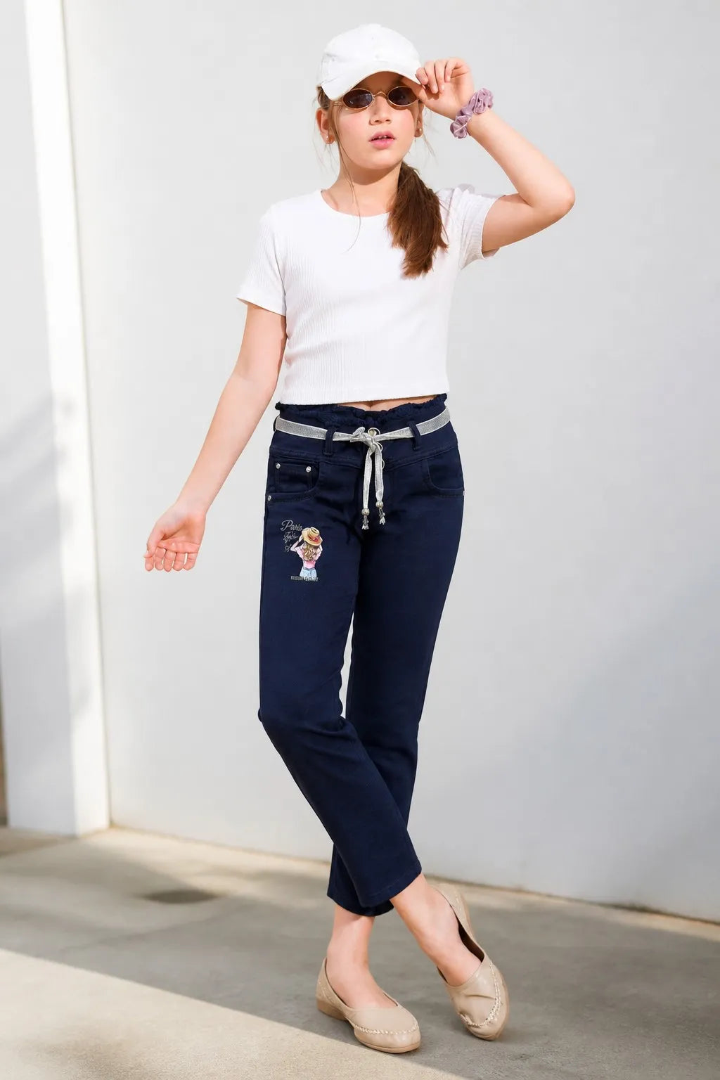 Girl in blue printed tie-waist straight jeans with a white tee, Gilly Billy