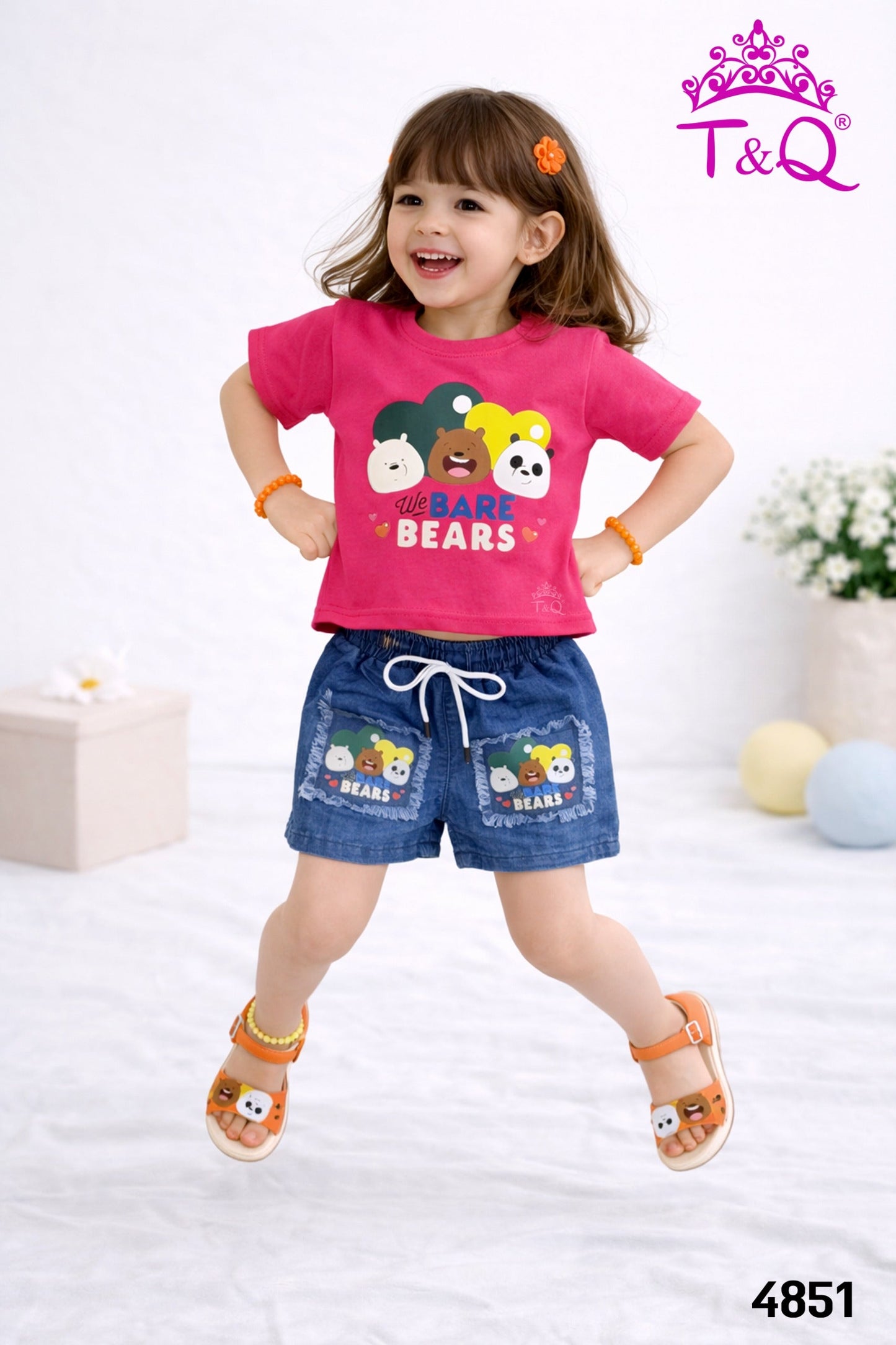 Girl in a rani pink bear print t-shirt and denim shorts set by T and Q