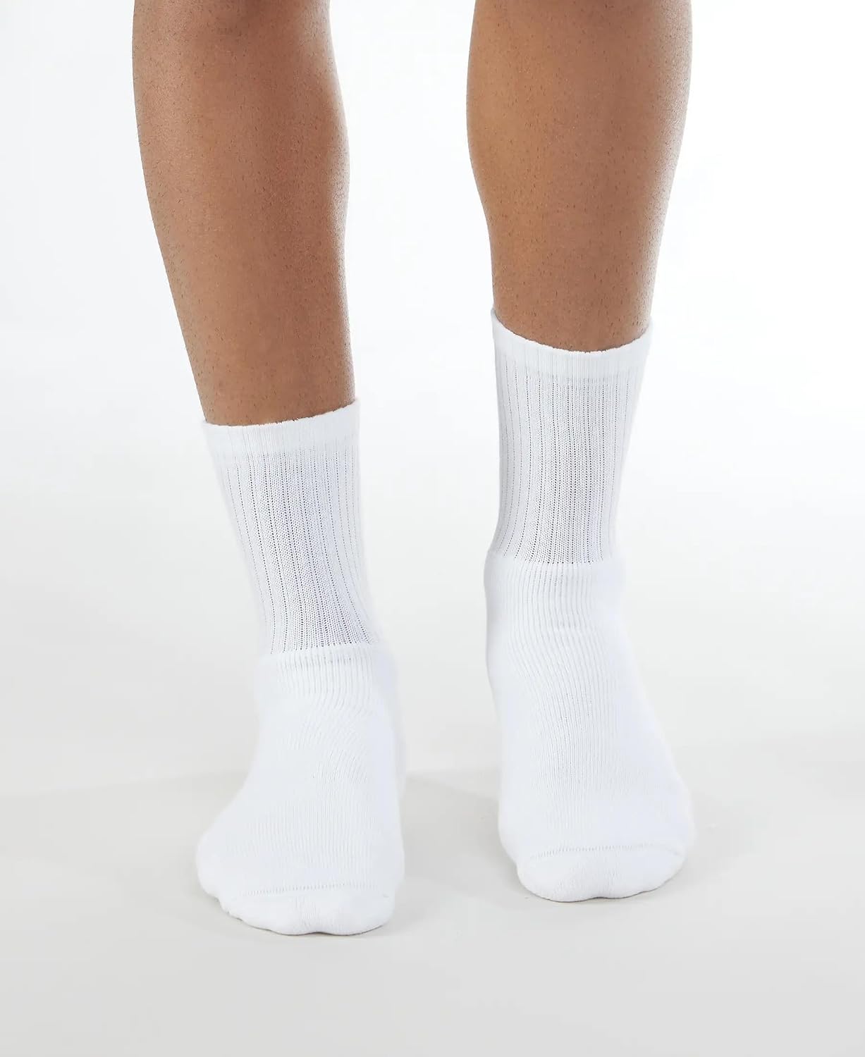 Model wearing Jockey men's white crew length cotton socks