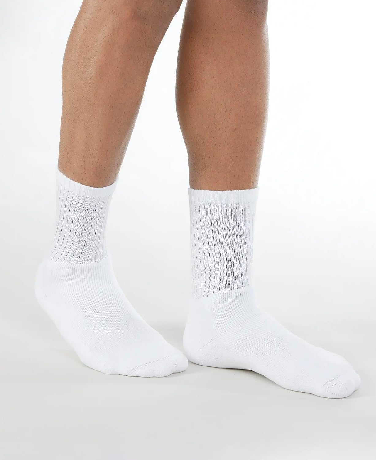 Side view of Jockey men's white crew length socks on a model