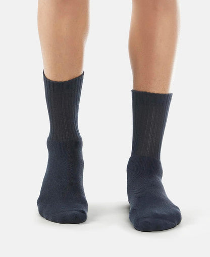 Model wearing Jockey navy crew length cotton terry socks