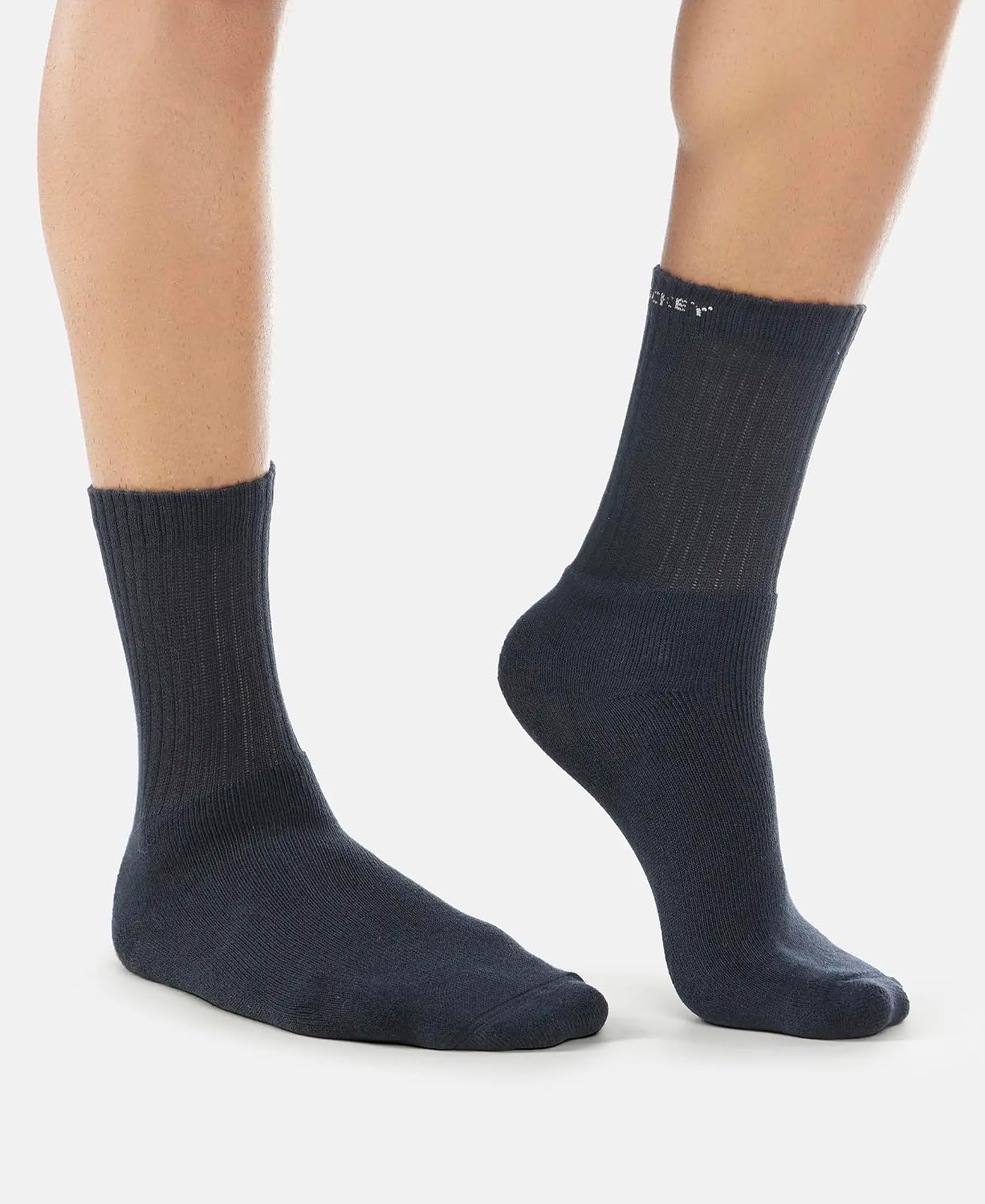 Side view of Jockey navy crew length cotton terry socks on a model