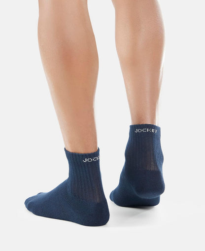 Front view of Jockey navy ankle length cotton terry socks on a model