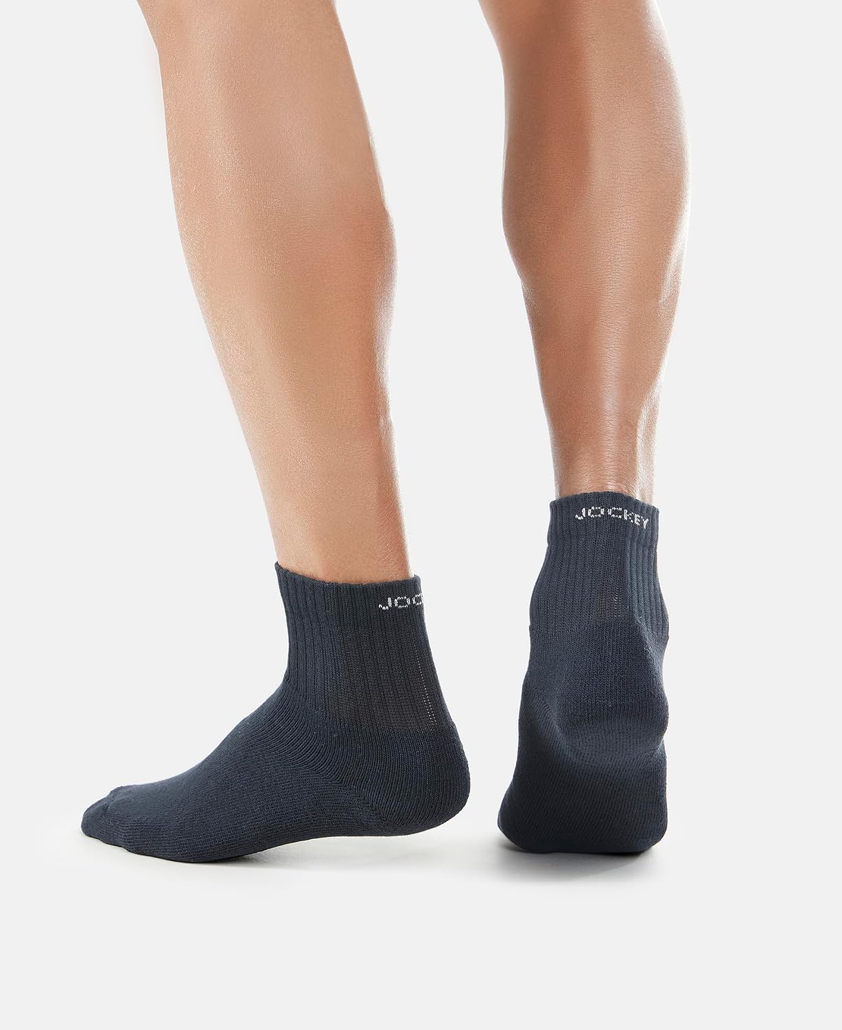 Rear view of a model wearing Jockey navy ankle length terry socks