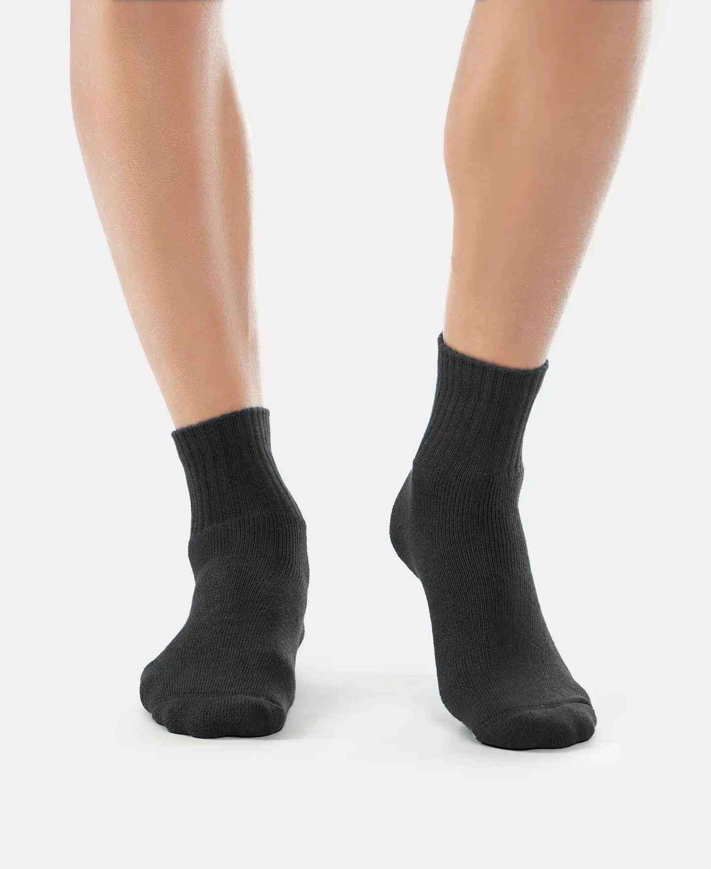 Model wearing Jockey black ankle length cotton terry socks