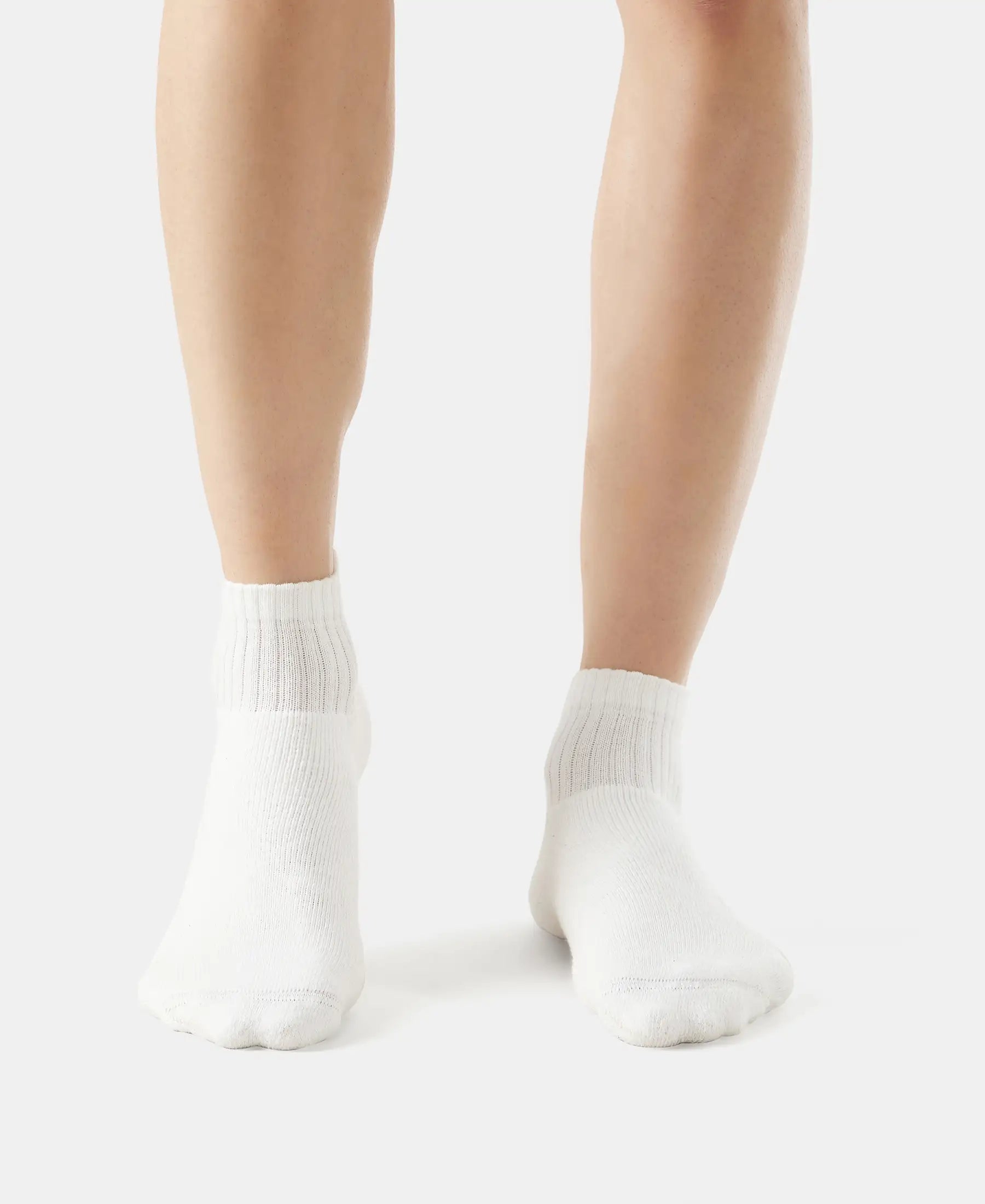 Model wearing Jockey white ankle length cotton terry socks