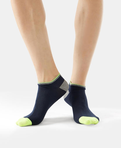 Rear view of Jockey men's navy low show cotton stretch socks on a model