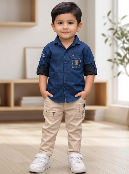 Boy in a blue denim shirt and beige pant set by Boyz Fun