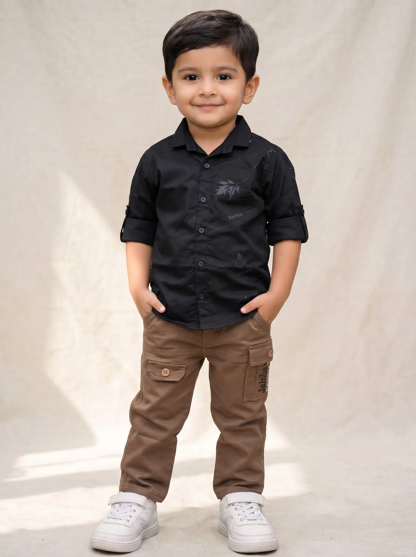 Boy in a black shirt and brown cargo pant set by Boyz Fun