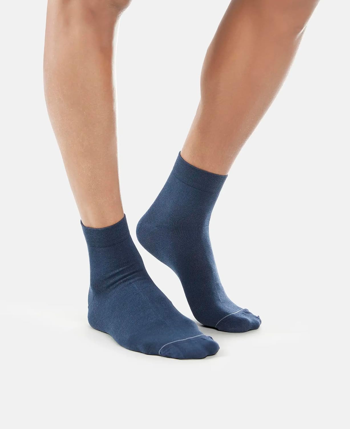 Model wearing Jockey navy international ankle length socks