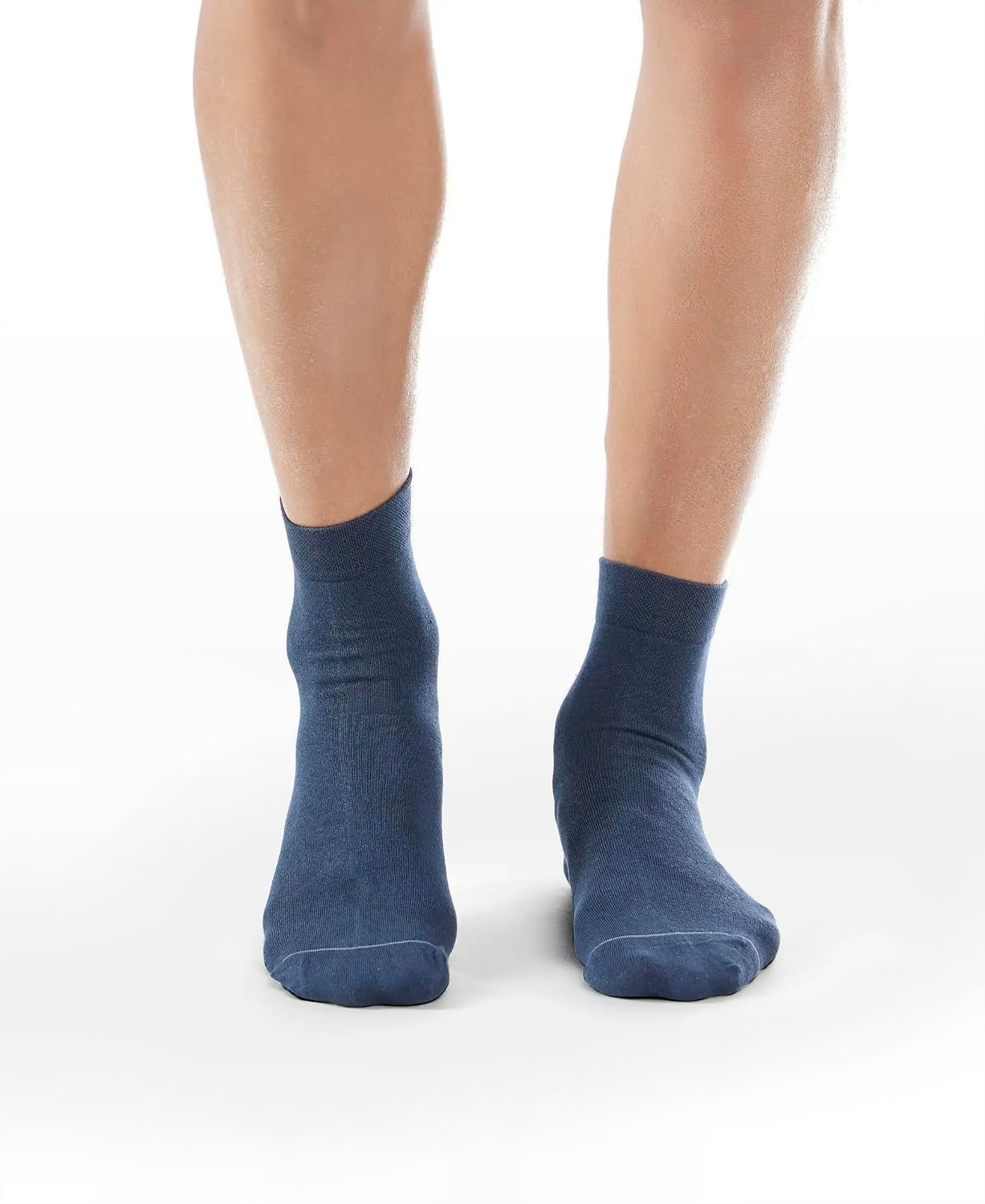 Front view of Jockey navy international ankle length socks on a model