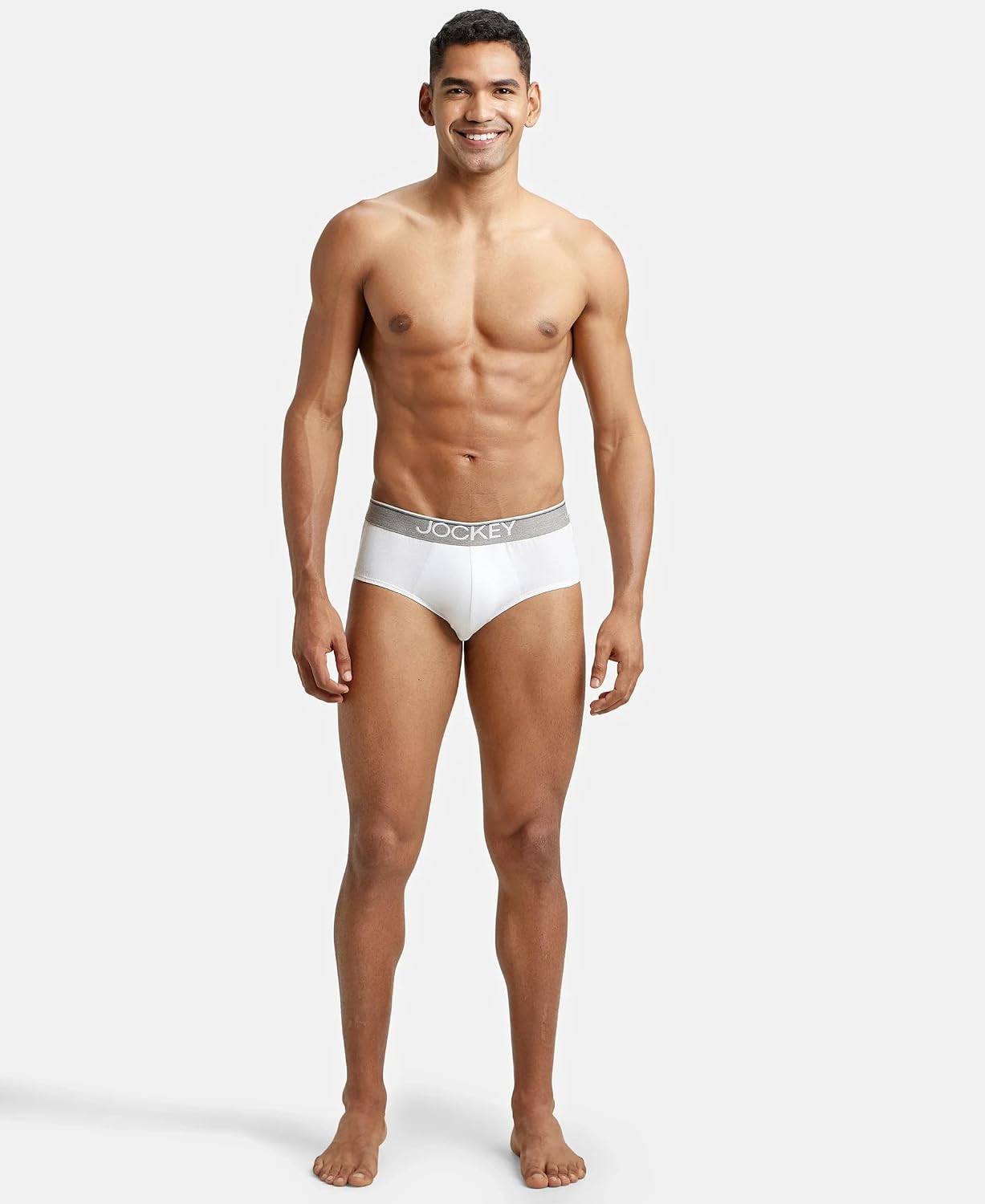 Full-length view of a model wearing Jockey white cotton briefs