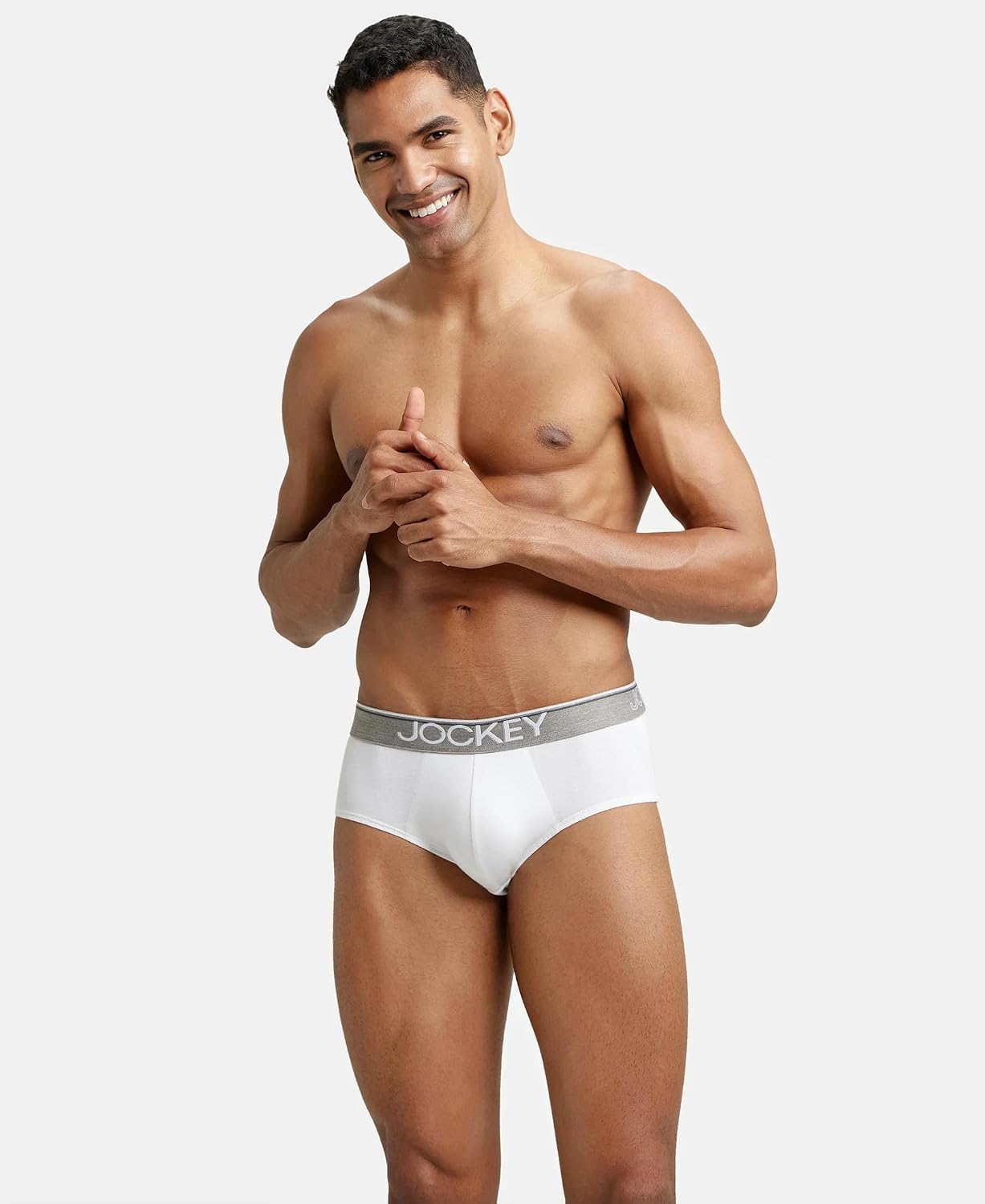 Model with arms crossed wearing Jockey white cotton briefs
