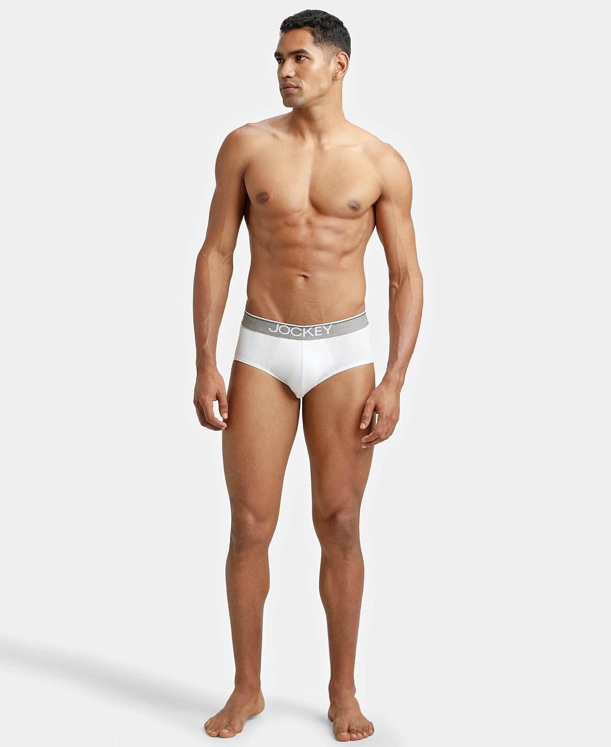 Model standing in Jockey white cotton briefs, full body shot