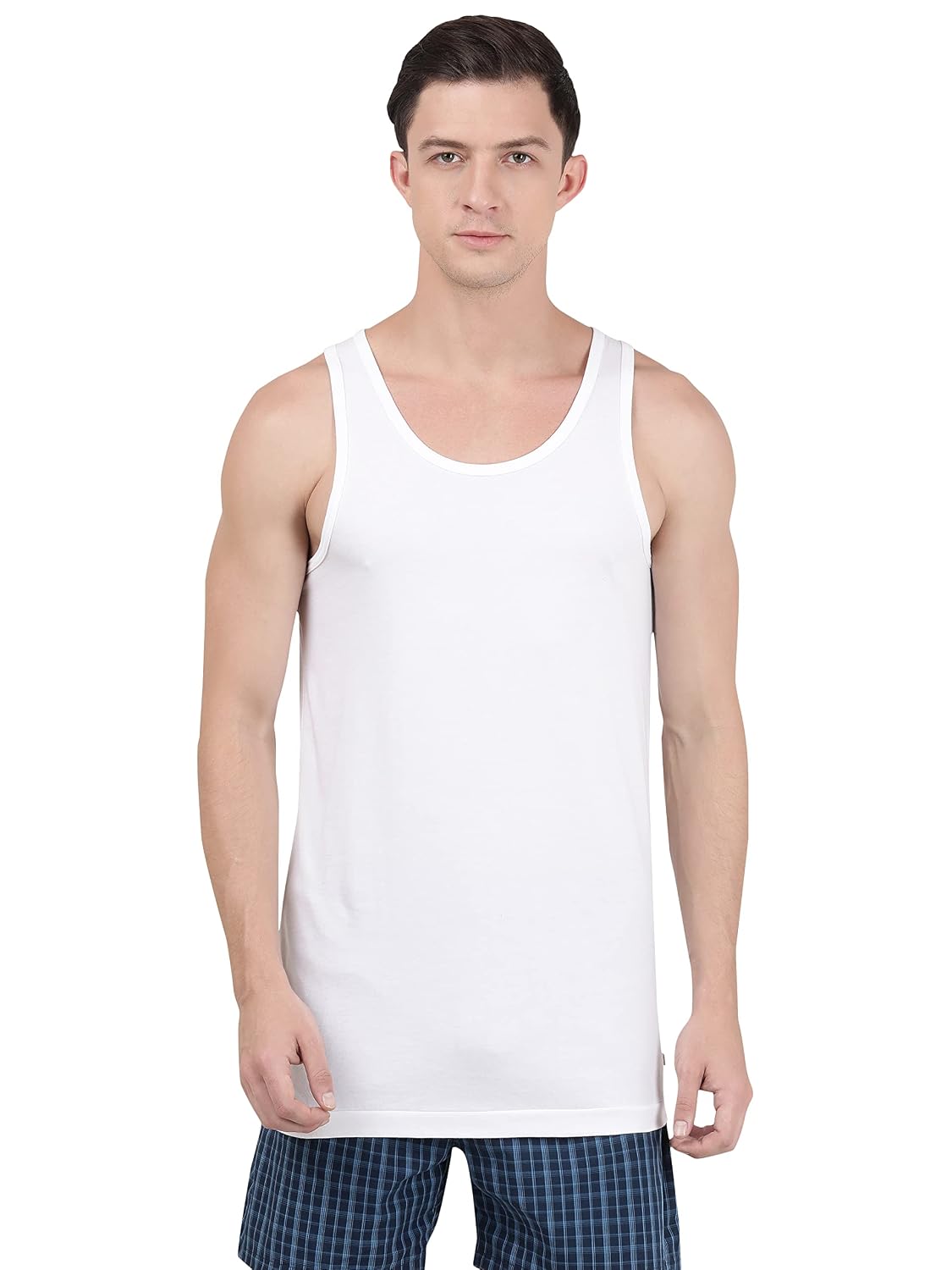 Jockey men's white sleeveless cotton vest, front view on model