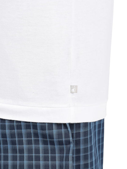 Hem detail of a Jockey men's white sleeveless cotton vest over checked shorts