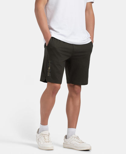 Model walking in Jockey men's olive straight fit cotton shorts