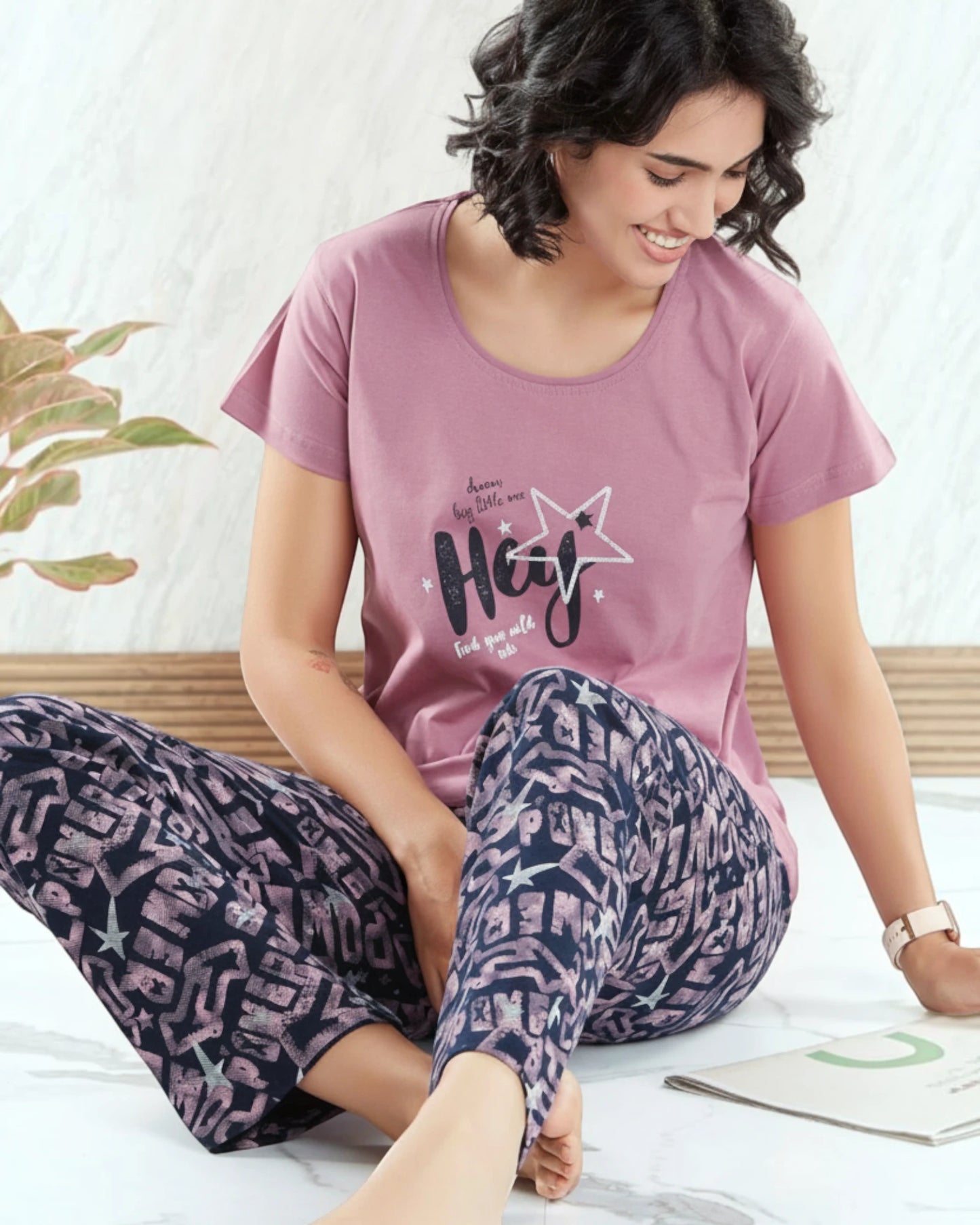 Woman in a pink star Hey print tee and navy printed pyjama, In Touche cotton night suit