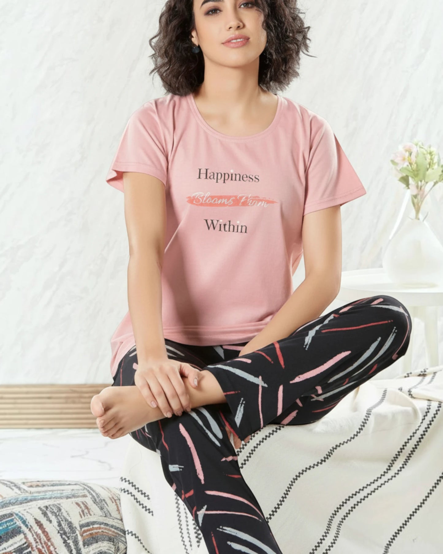 Woman in a pink Happiness Blooms tee and printed pyjama, In Touche cotton night suit