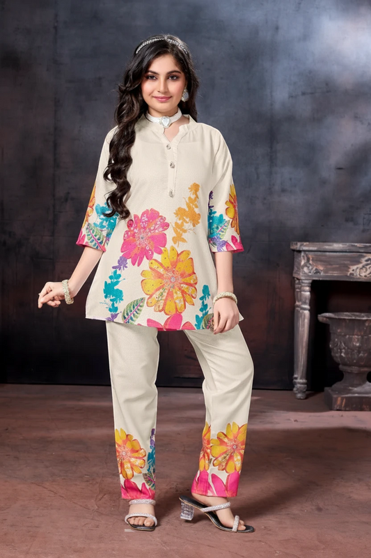 Girl in a cream floral kurti with printed pant set by Bimbee
