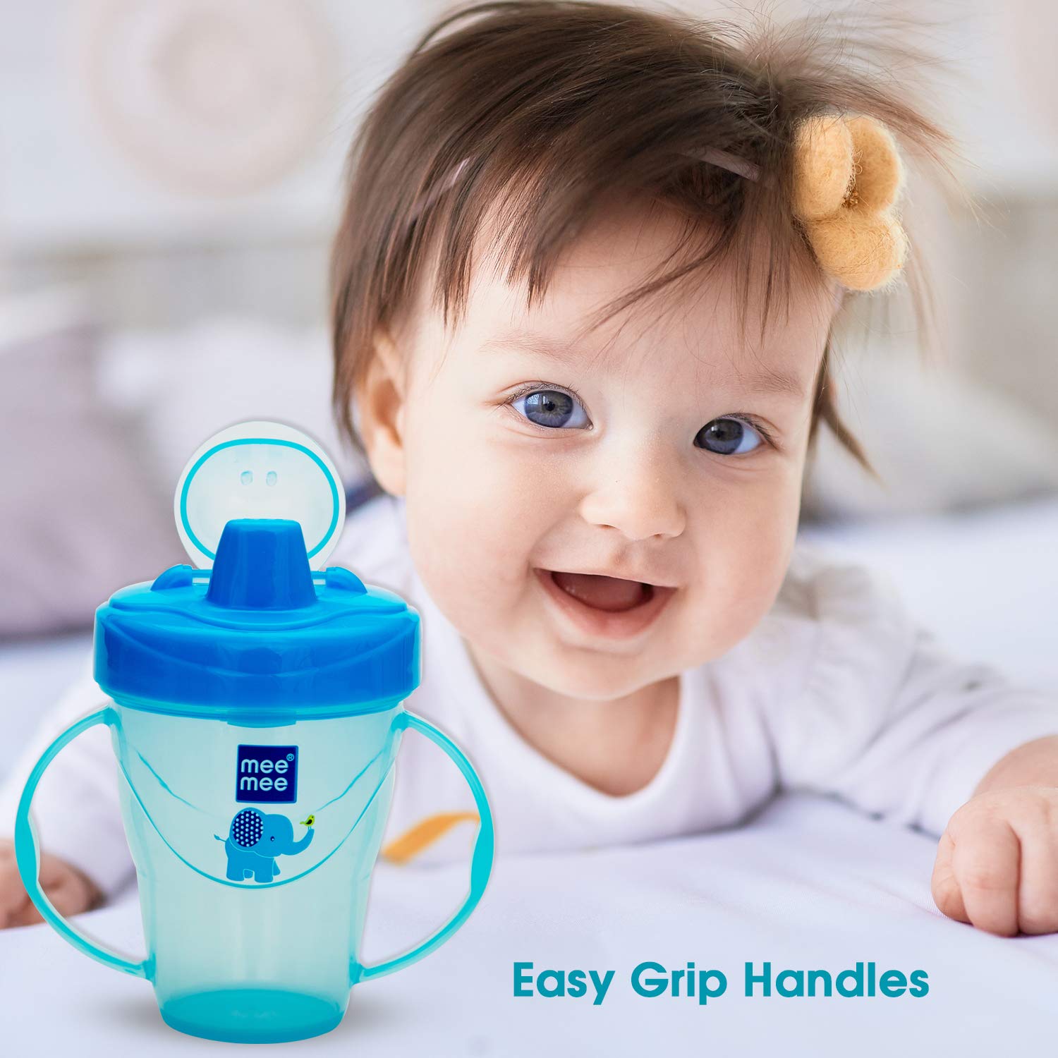 Mee Mee sipper cup with easy grip handles sized for a baby to hold