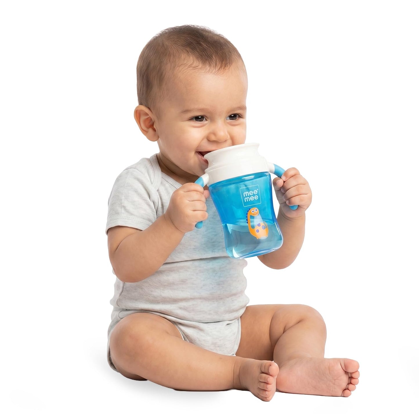 Baby drinking from a blue Mee Mee 360 degree trainer cup